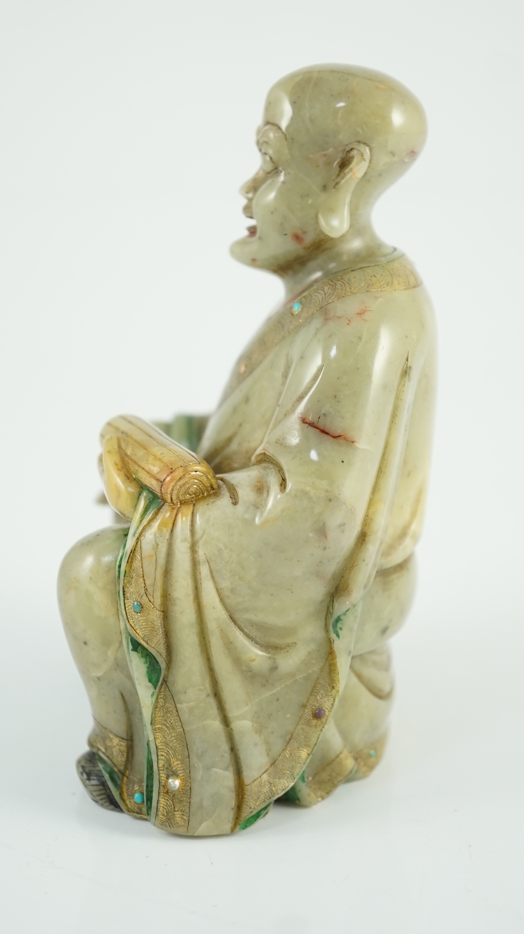 A Chinese soapstone seated figure of a luohan, 18th century, 12.5cm high